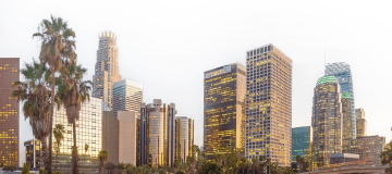 California city skyline with palm trees and tall buildings